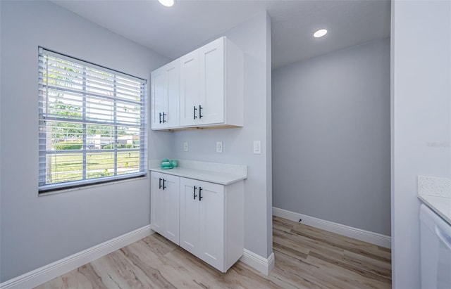3143 Mission Grove Dr, Palm Harbor, FL 34684 - laundry room with recessed lighting and baseboards