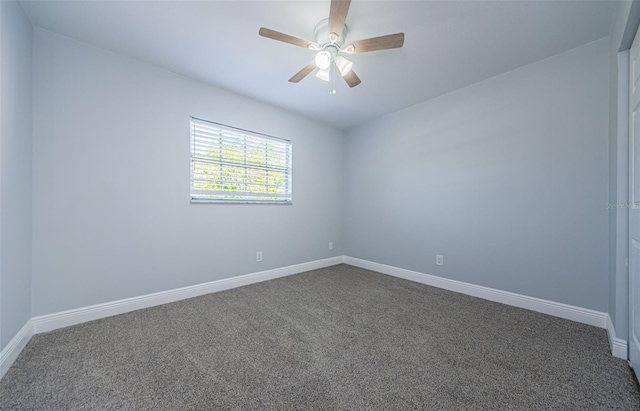 3143 Mission Grove Dr, Palm Harbor, FL 34684 - unfurnished room with baseboards, a ceiling fan, and dark colored carpet