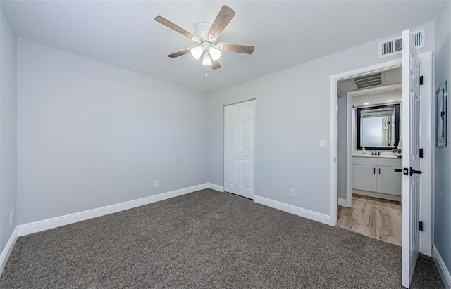 3143 Mission Grove Dr, Palm Harbor, FL 34684 - unfurnished bedroom featuring visible vents, baseboards, and carpet floors