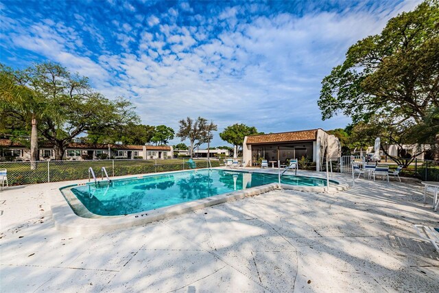 3143 Mission Grove Dr, Palm Harbor, FL 34684 - pool featuring a patio area and fence