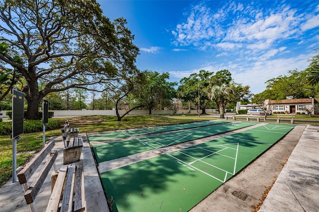 3143 Mission Grove Dr, Palm Harbor, FL 34684 - view of community with a lawn and shuffleboard