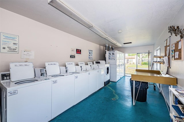 3143 Mission Grove Dr, Palm Harbor, FL 34684 - community laundry room with visible vents and washing machine and dryer