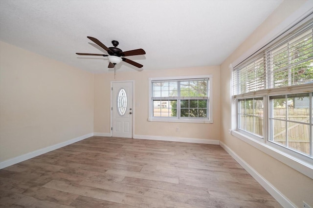 2585 9th Ave N, Saint Petersburg, FL 33713 - foyer entrance featuring light wood-type flooring, ceiling fan, and baseboards