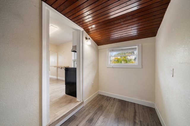 2585 9th Ave N, Saint Petersburg, FL 33713 - empty room with wood ceiling, baseboards, and wood finished floors
