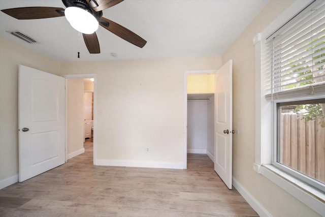 2585 9th Ave N, Saint Petersburg, FL 33713 - unfurnished bedroom featuring light wood finished floors, baseboards, and a ceiling fan