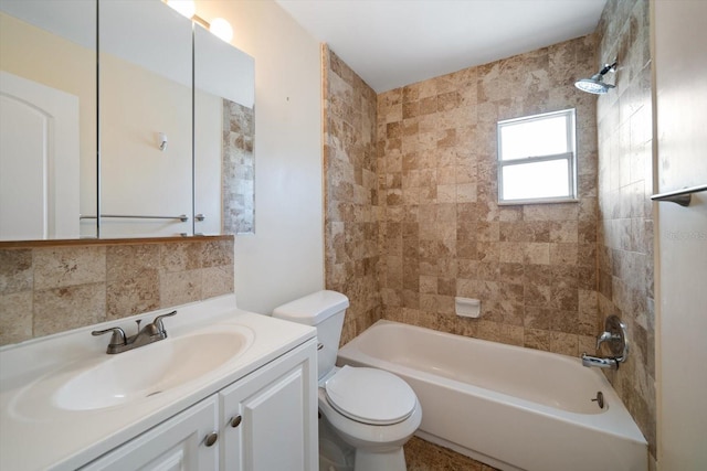 2585 9th Ave N, Saint Petersburg, FL 33713 - full bathroom with toilet,  shower combination, vanity, and tasteful backsplash