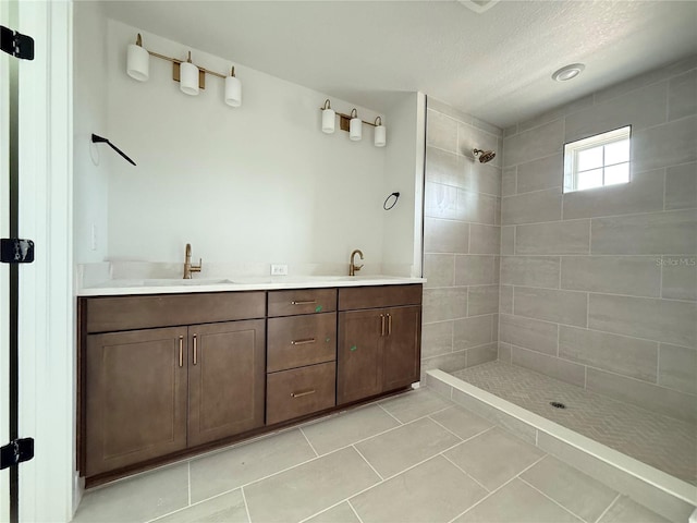 5235 9th Ave N, Saint Petersburg, FL 33710 - full bath featuring a sink, tile patterned floors, a tile shower, and double vanity