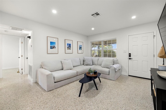 living room with baseboards, visible vents, and recessed lighting
