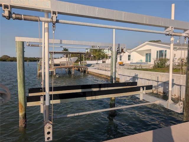 view of dock with a water view and boat lift