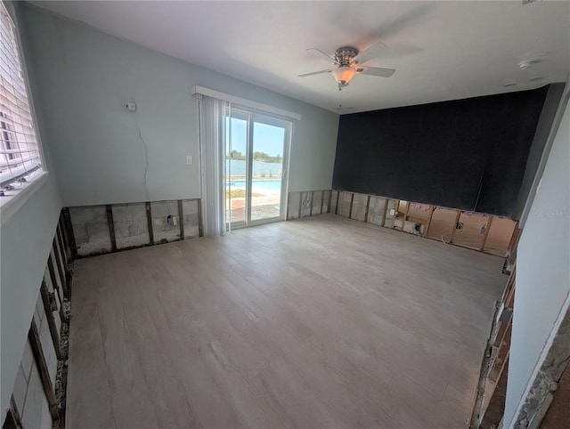 interior space featuring wood finished floors and ceiling fan