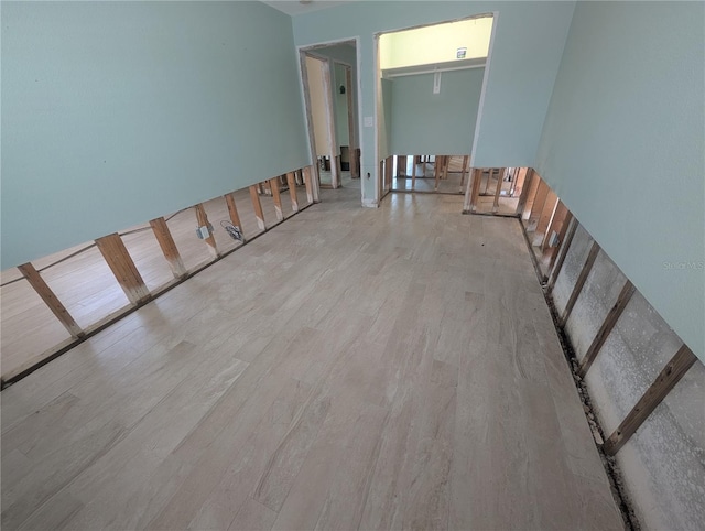 unfurnished room featuring wood finished floors