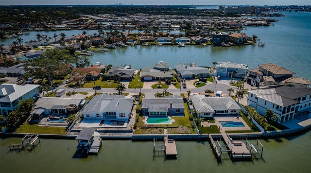 drone / aerial view with a residential view and a water view