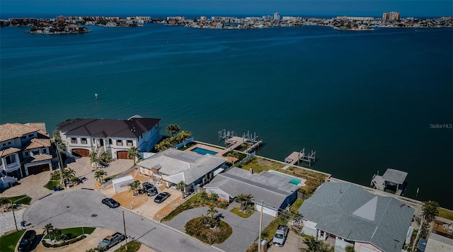 drone / aerial view with a residential view and a water view