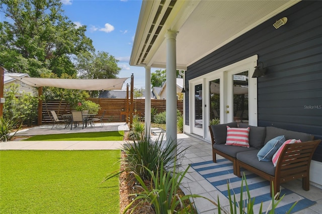 view of patio with outdoor lounge area and fence