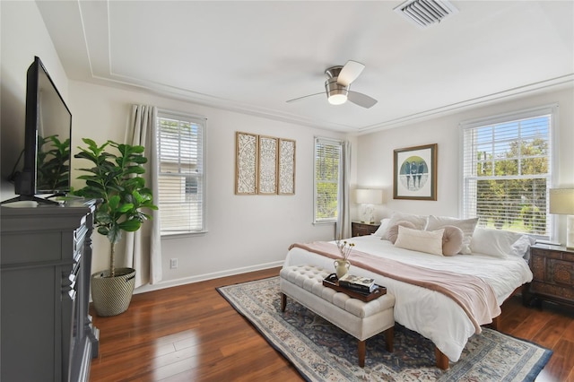 bedroom with baseboards, visible vents, ceiling fan, and dark wood-style flooring