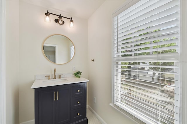 bathroom featuring baseboards and vanity