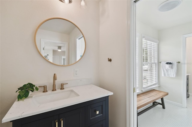 bathroom with baseboards and vanity