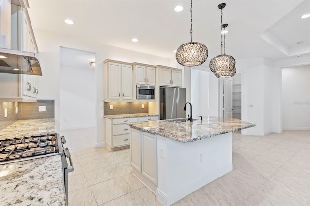 30900 Spruceberry Ct, Wesley Chapel, FL 33543 - kitchen featuring tasteful backsplash, exhaust hood, a sink, recessed lighting, and stainless steel appliances