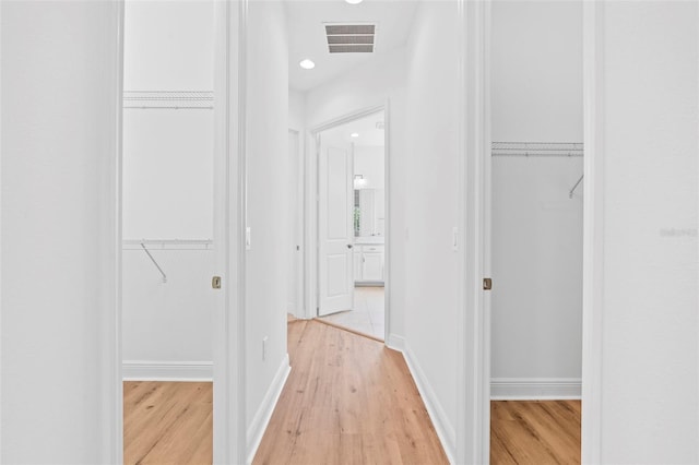 30900 Spruceberry Ct, Wesley Chapel, FL 33543 - hall featuring recessed lighting, visible vents, and light wood-type flooring