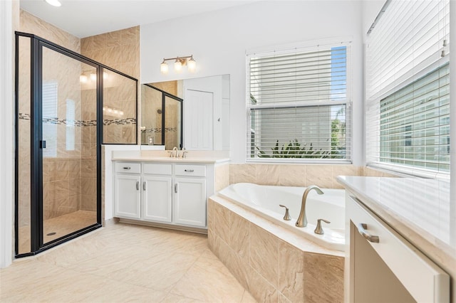 30900 Spruceberry Ct, Wesley Chapel, FL 33543 - full bathroom with a stall shower, a garden tub, vanity, and tile patterned floors