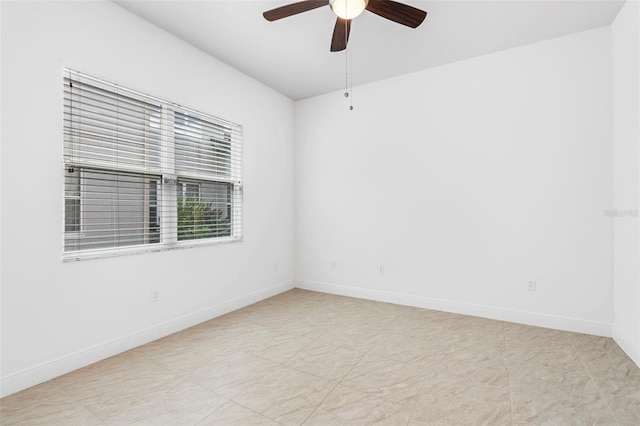30900 Spruceberry Ct, Wesley Chapel, FL 33543 - spare room with ceiling fan and baseboards