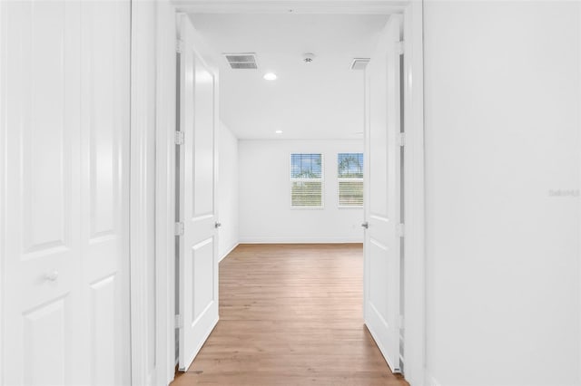 30900 Spruceberry Ct, Wesley Chapel, FL 33543 - hall featuring light wood-type flooring, baseboards, visible vents, and recessed lighting