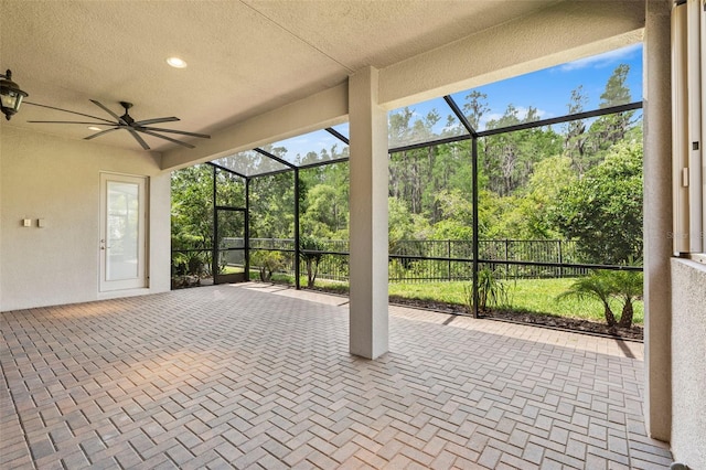 30900 Spruceberry Ct, Wesley Chapel, FL 33543 - view of patio with fence, a lanai, and a ceiling fan