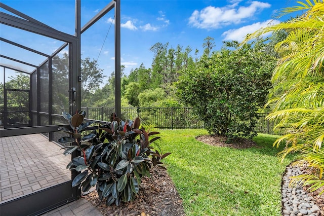 30900 Spruceberry Ct, Wesley Chapel, FL 33543 - view of yard with a patio area, fence, and glass enclosure