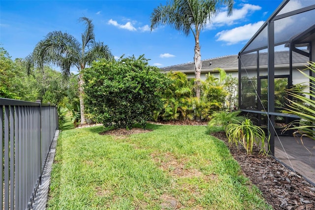30900 Spruceberry Ct, Wesley Chapel, FL 33543 - view of yard featuring fence and glass enclosure