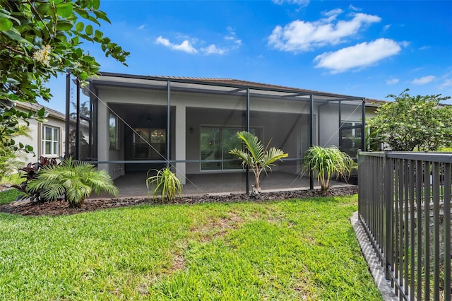 30900 Spruceberry Ct, Wesley Chapel, FL 33543 - back of house featuring a lanai, a yard, a patio area, and stucco siding