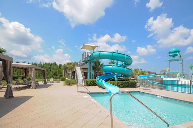 30900 Spruceberry Ct, Wesley Chapel, FL 33543 - pool featuring a water play area, a water slide, a patio area, a gazebo, and fence