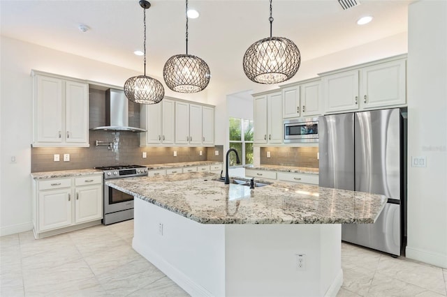 30900 Spruceberry Ct, Wesley Chapel, FL 33543 - kitchen with wall chimney exhaust hood, a sink, stainless steel appliances, a notable chandelier, and backsplash