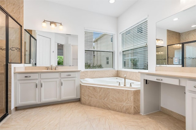 30900 Spruceberry Ct, Wesley Chapel, FL 33543 - bathroom with a stall shower, a garden tub, vanity, and recessed lighting