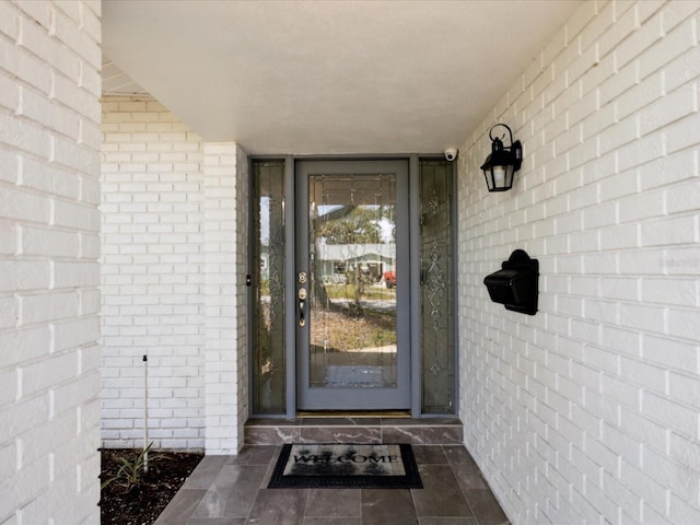 1666 N Dakota Ave NE, Saint Petersburg, FL 33703 - view of exterior entry with brick siding