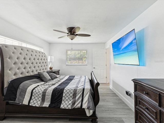 1666 N Dakota Ave NE, Saint Petersburg, FL 33703 - bedroom with light wood finished floors, baseboards, and a ceiling fan