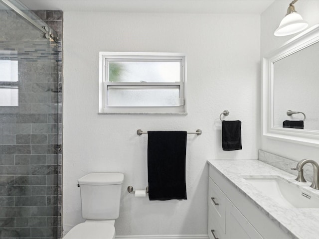 1666 N Dakota Ave NE, Saint Petersburg, FL 33703 - bathroom with toilet, vanity, and a tile shower