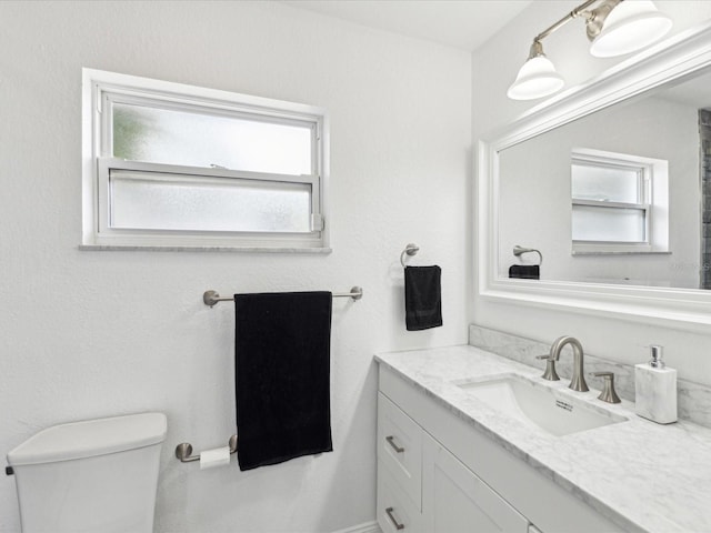 1666 N Dakota Ave NE, Saint Petersburg, FL 33703 - bathroom with toilet and vanity