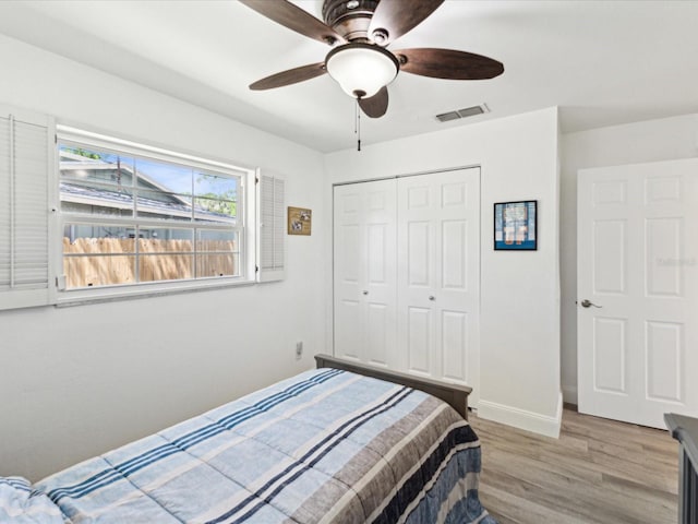 1666 N Dakota Ave NE, Saint Petersburg, FL 33703 - bedroom featuring a closet, a ceiling fan, light wood-type flooring, baseboards, and visible vents