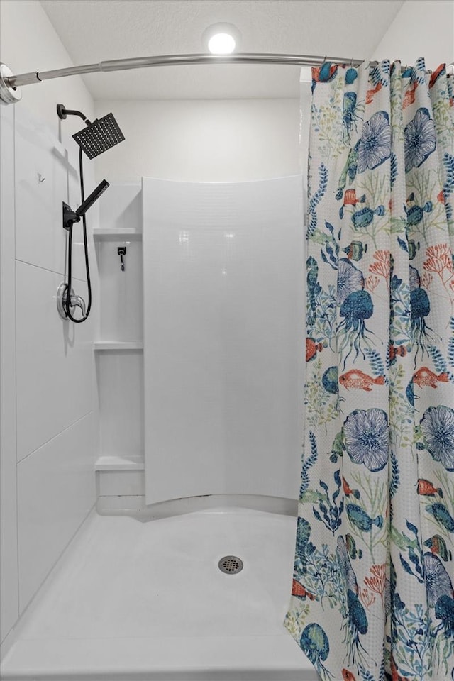 full bath featuring a stall shower
