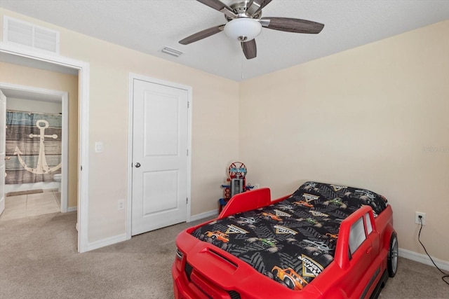 bedroom featuring baseboards, visible vents, and carpet flooring