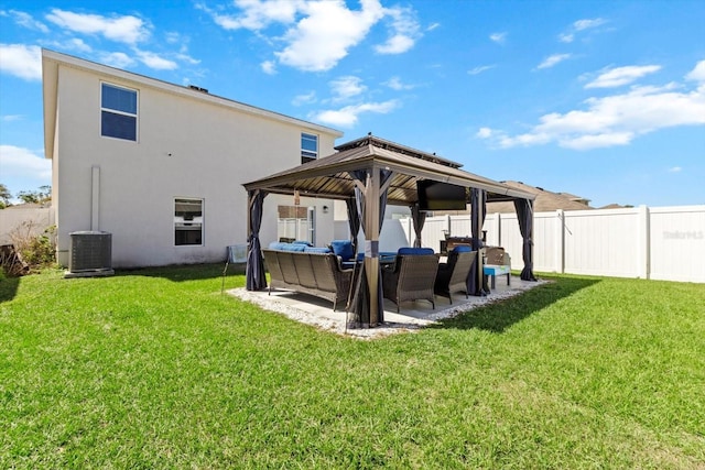 rear view of house featuring an outdoor hangout area, a gazebo, a patio area, and a lawn
