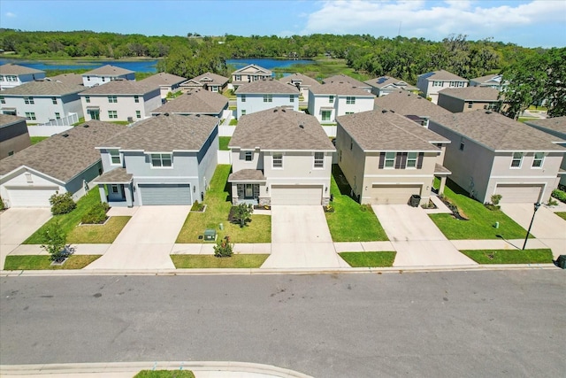 aerial view with a water view and a residential view