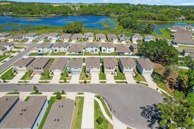 birds eye view of property with a residential view and a water view