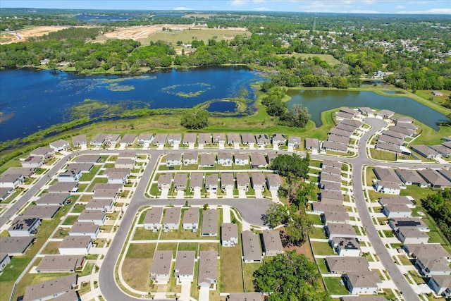bird's eye view with a residential view and a water view