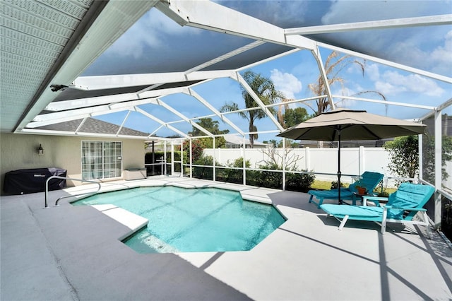 view of pool featuring fence, a patio, and a lanai