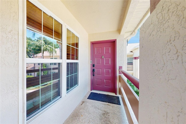 property entrance featuring stucco siding