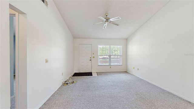 spare room with carpet flooring, ceiling fan, and baseboards