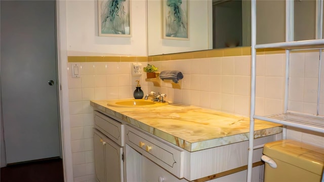 bathroom featuring tile walls and vanity