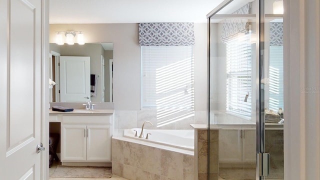 1919 Blissful Dr, Kissimmee, FL 34744 - full bathroom featuring vanity, a shower stall, and a bath