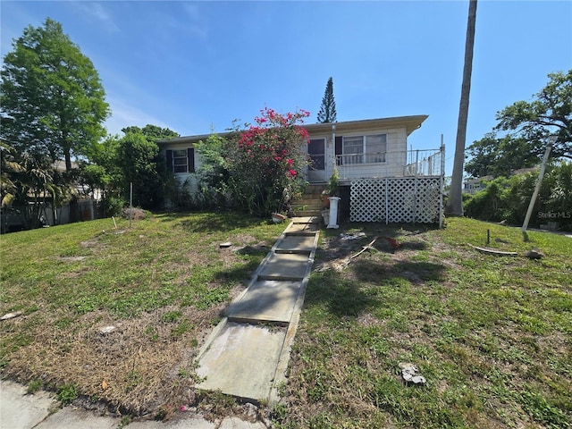 view of front of house with a front lawn